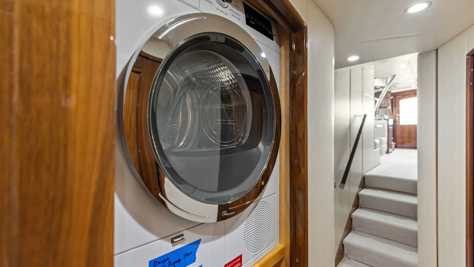 Hallway Laundry Area with Dryer