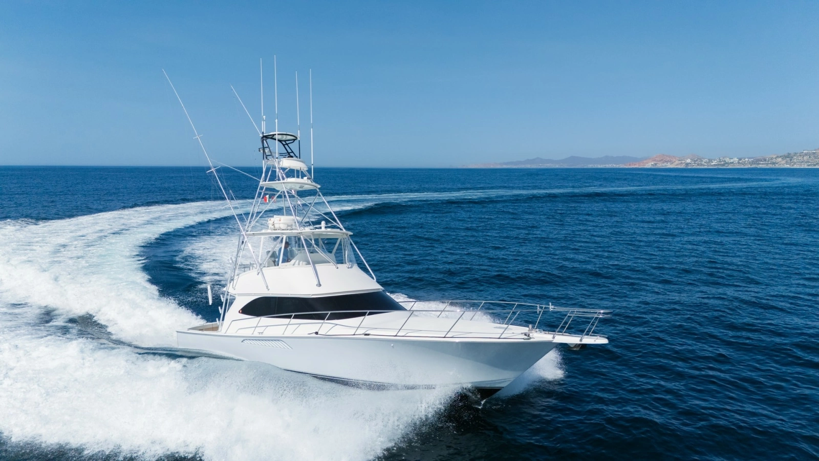 2009 Viking 50 Convertible "Jammin" - Starboard Bow View Highlighting the Yacht's Graceful Profile and On-Water Presence.