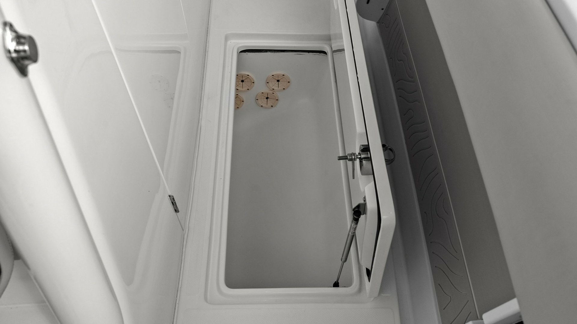 Spacious In-Deck Storage Compartment