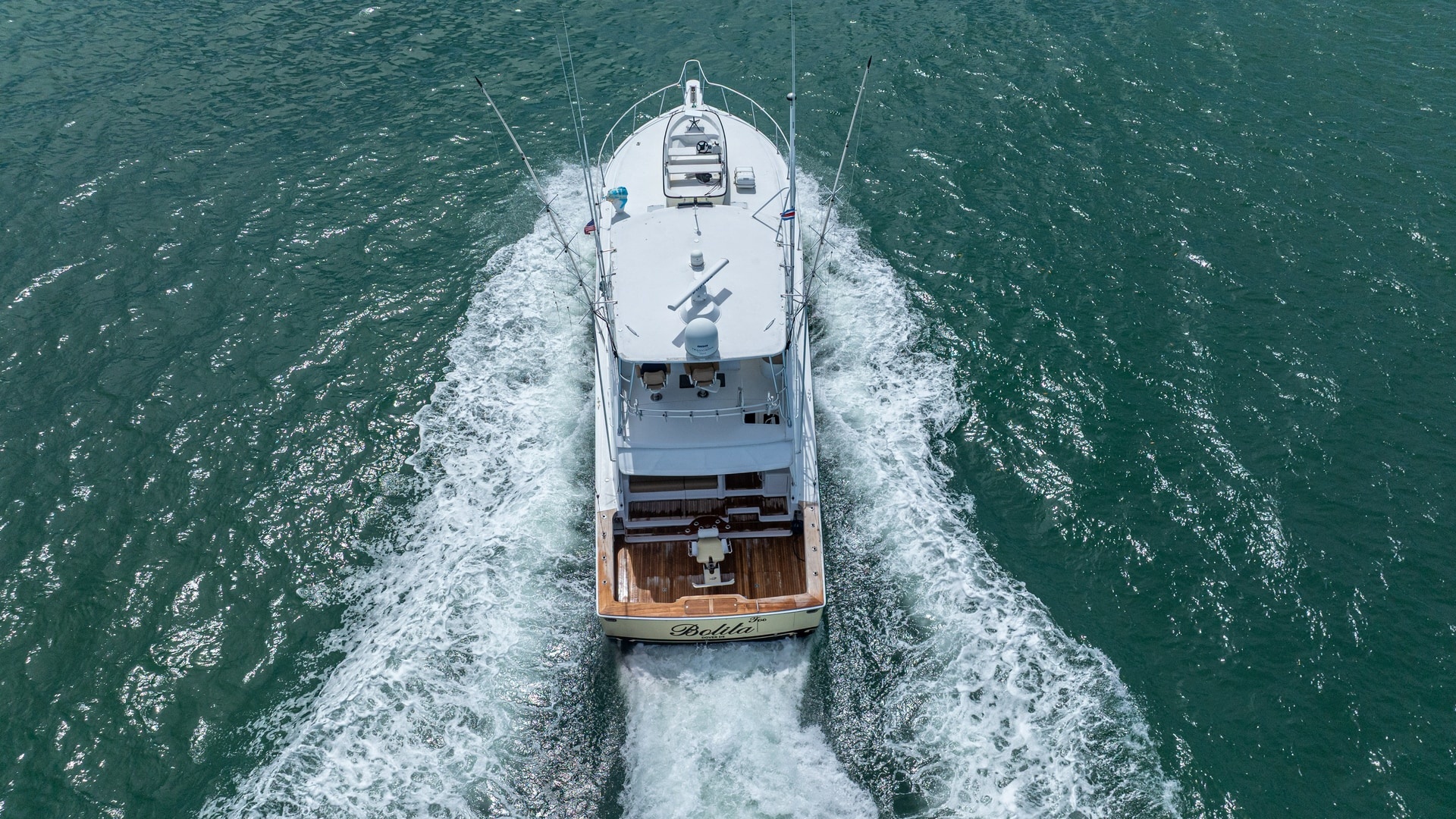 Aerial View of Stern in Motion 2002 Viking 61 Convertible