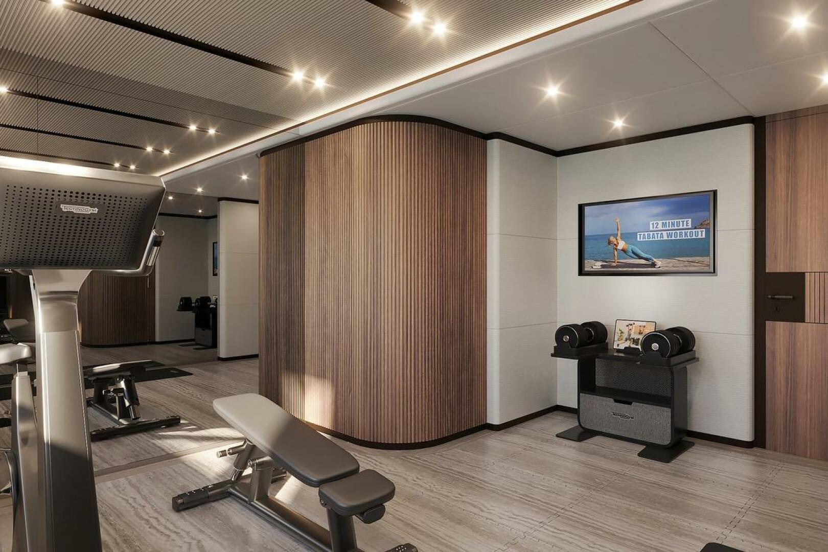 Luxurious gym interior on Majesty 145 yacht, featuring moder