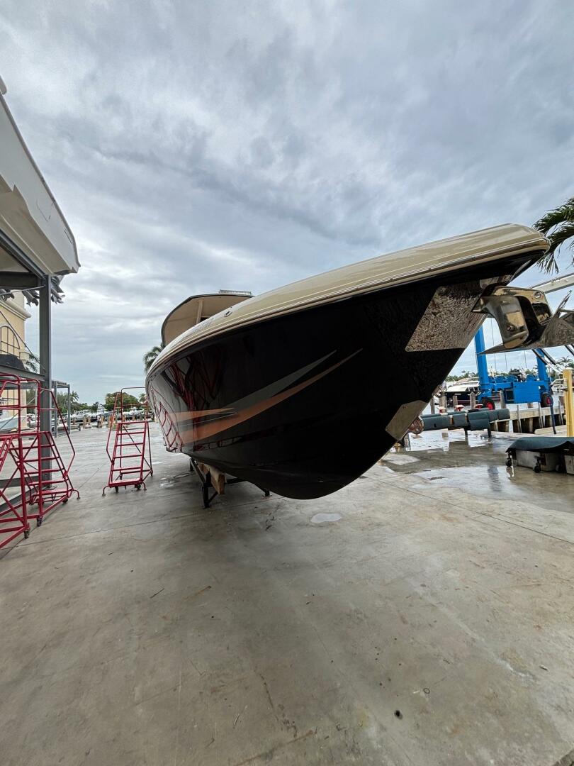 2013 Statement 35 Center Console boat on dry dock under clou