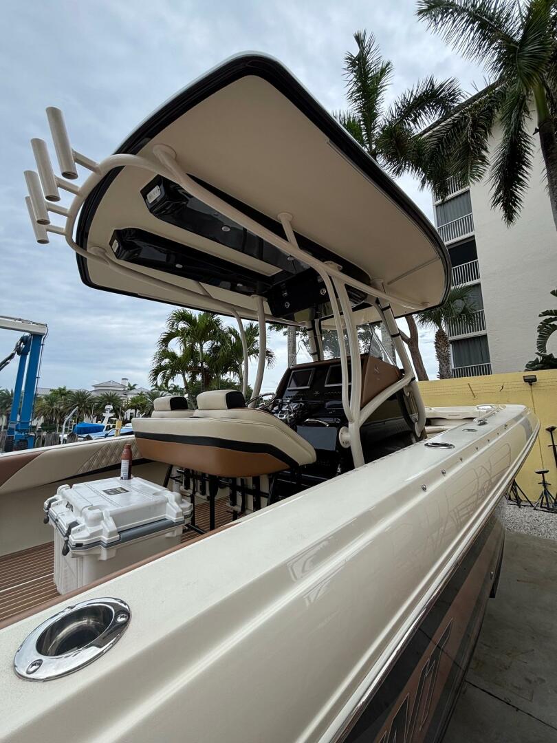 2013 Statement 35 Center Console boat with T-top, docked nea