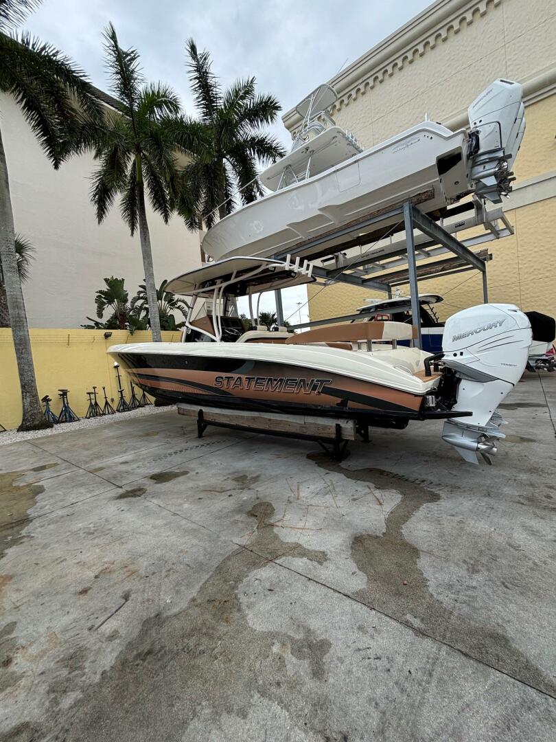 2013 Statement 35 Center Console boat on a dock with palm tr