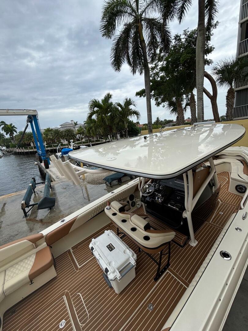2013 Statement 35 Center Console boat docked, featuring slee