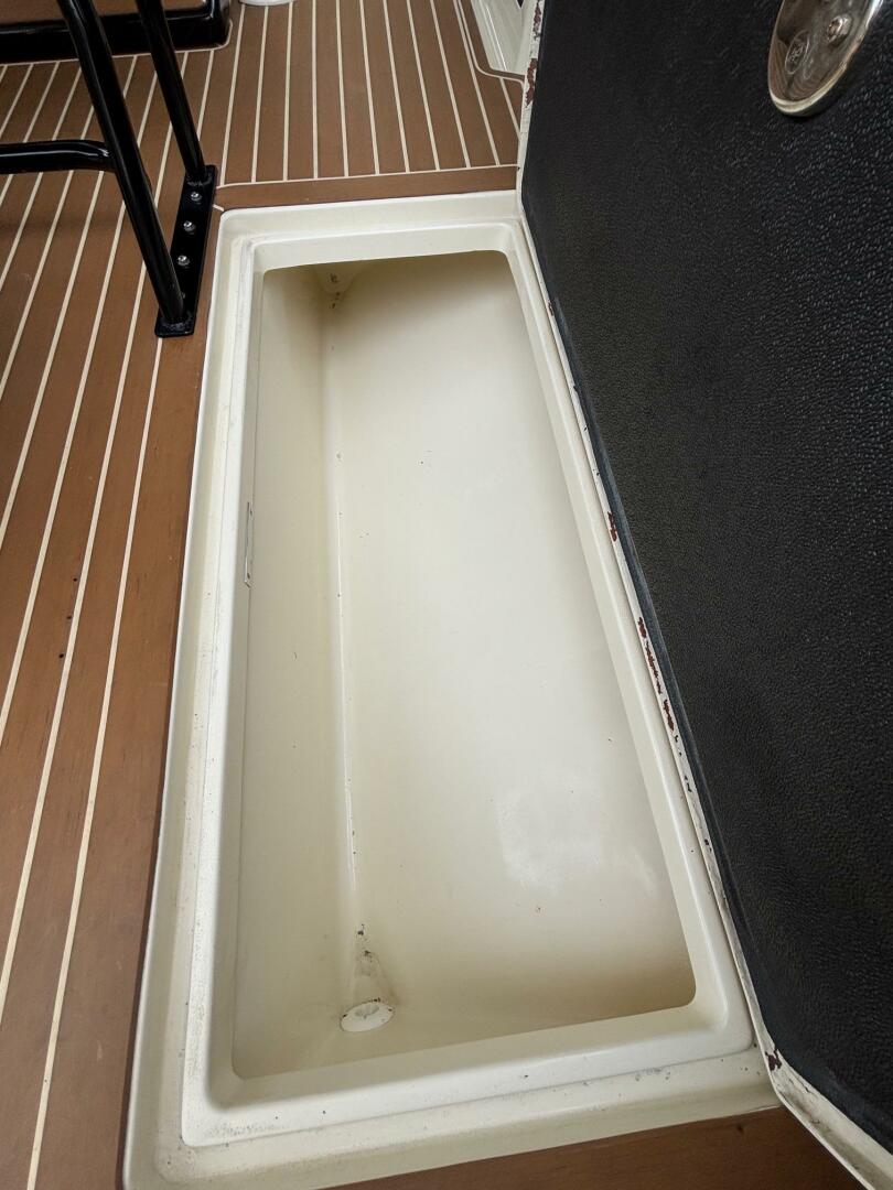 Open storage compartment on 2013 Statement 35 Center Console