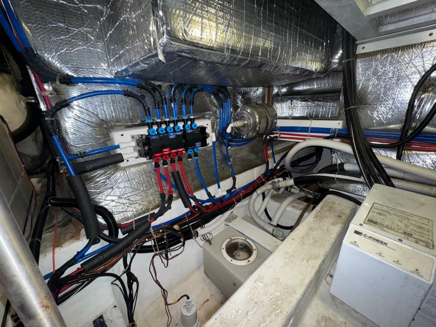 Engine room of a 2000 Carver 506 Motor Yacht with wiring and