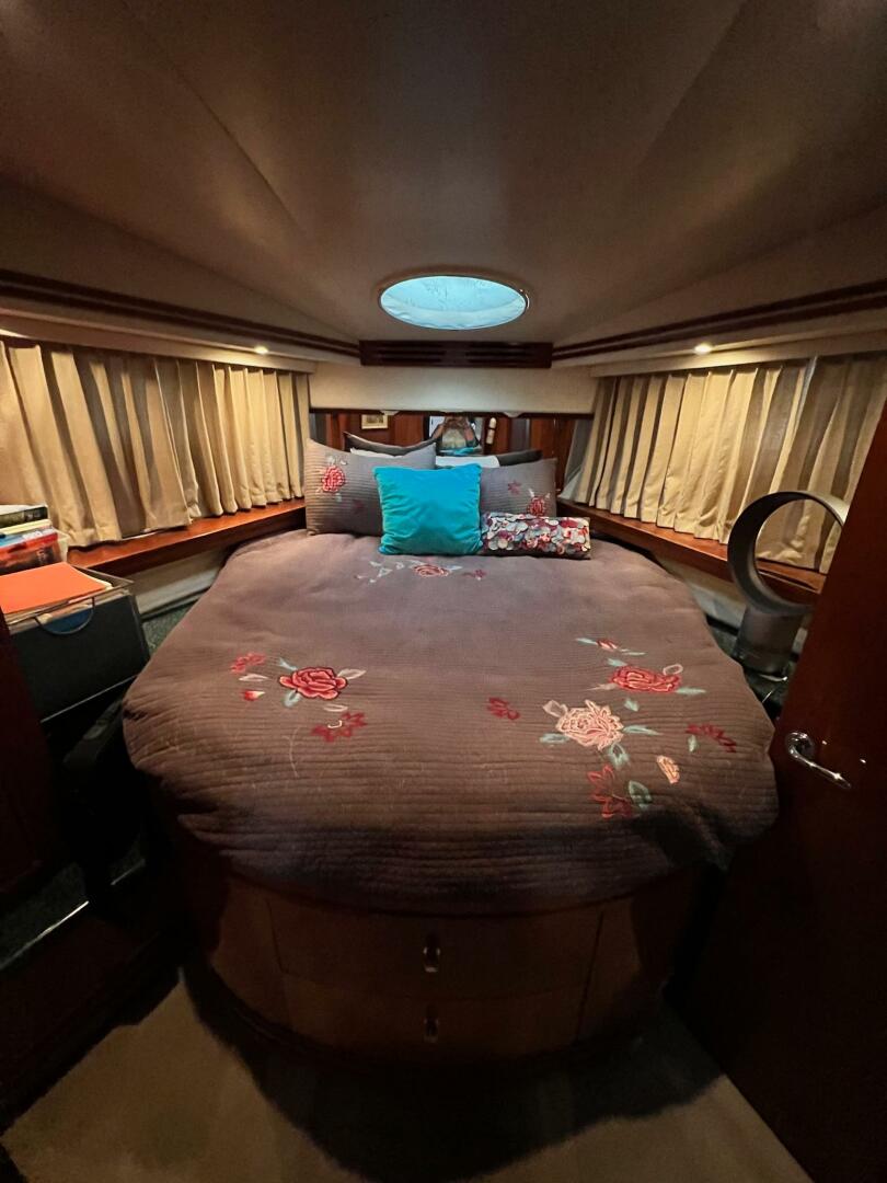 Luxurious bedroom in 2000 Carver 506 Motor Yacht with floral