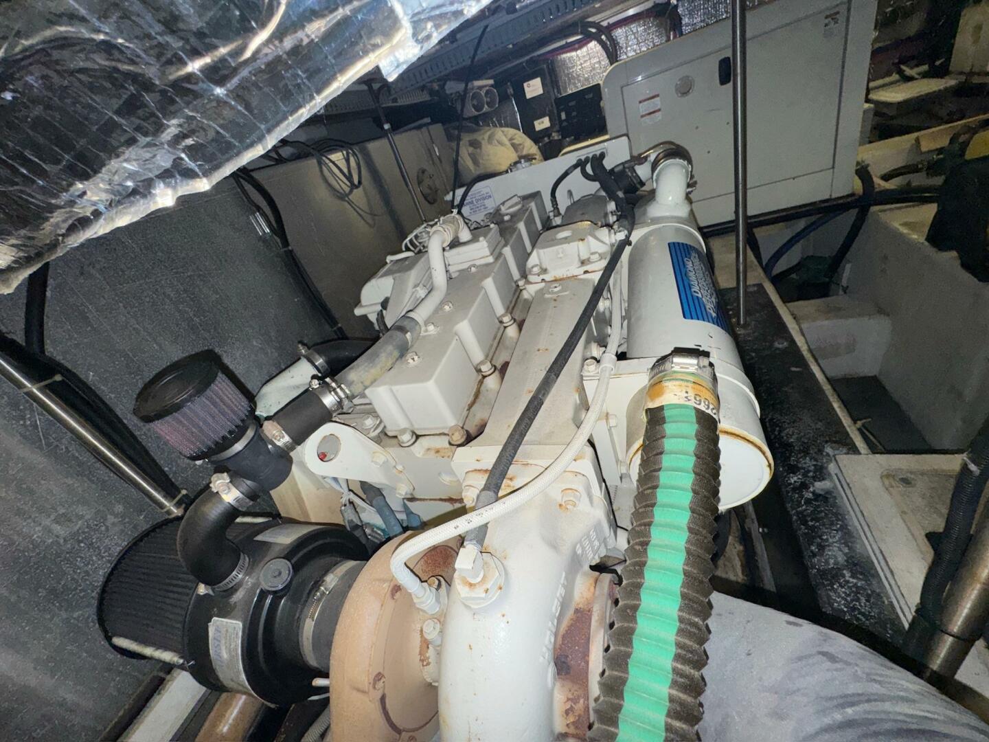 Engine room of 2000 Carver 506 Motor Yacht, showcasing mecha