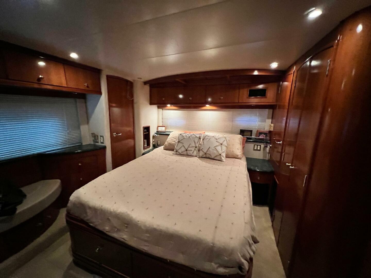 Luxurious bedroom interior of 2000 Carver 506 Motor Yacht wi