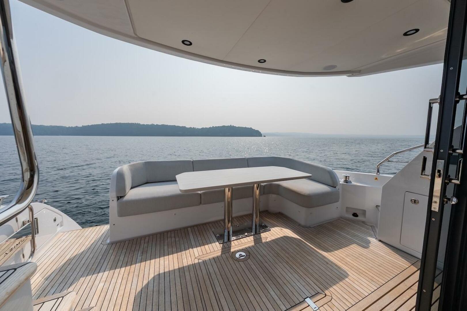 Luxury Azimut Fly 53 yacht deck with seating, overlooking se