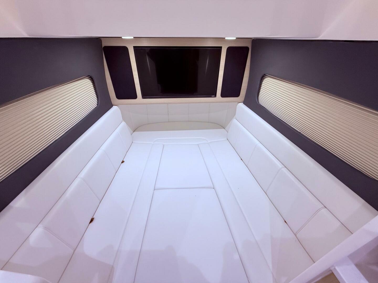 Luxurious interior cabin of 2024 Scout 400 LXF boat with whi