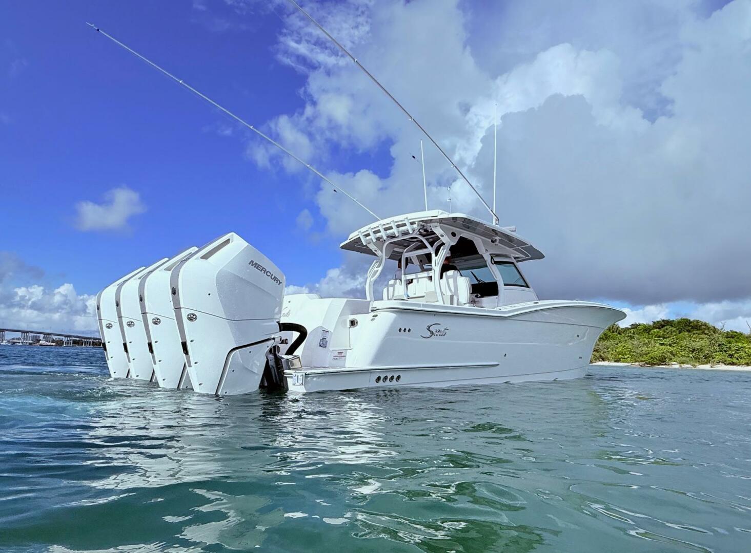 2024 Scout 400 LXF boat with multiple outboard engines on wa