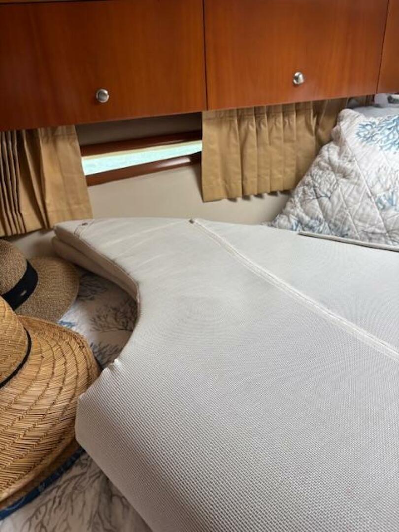 Interior of 2006 Carver 43 Motor Yacht with bed, pillows, an