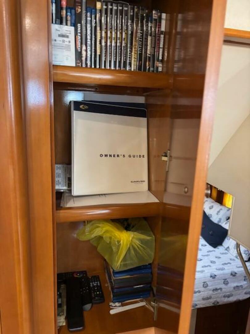 Owner's guide in wooden cabinet on Carver 43 Motor Yacht, 20