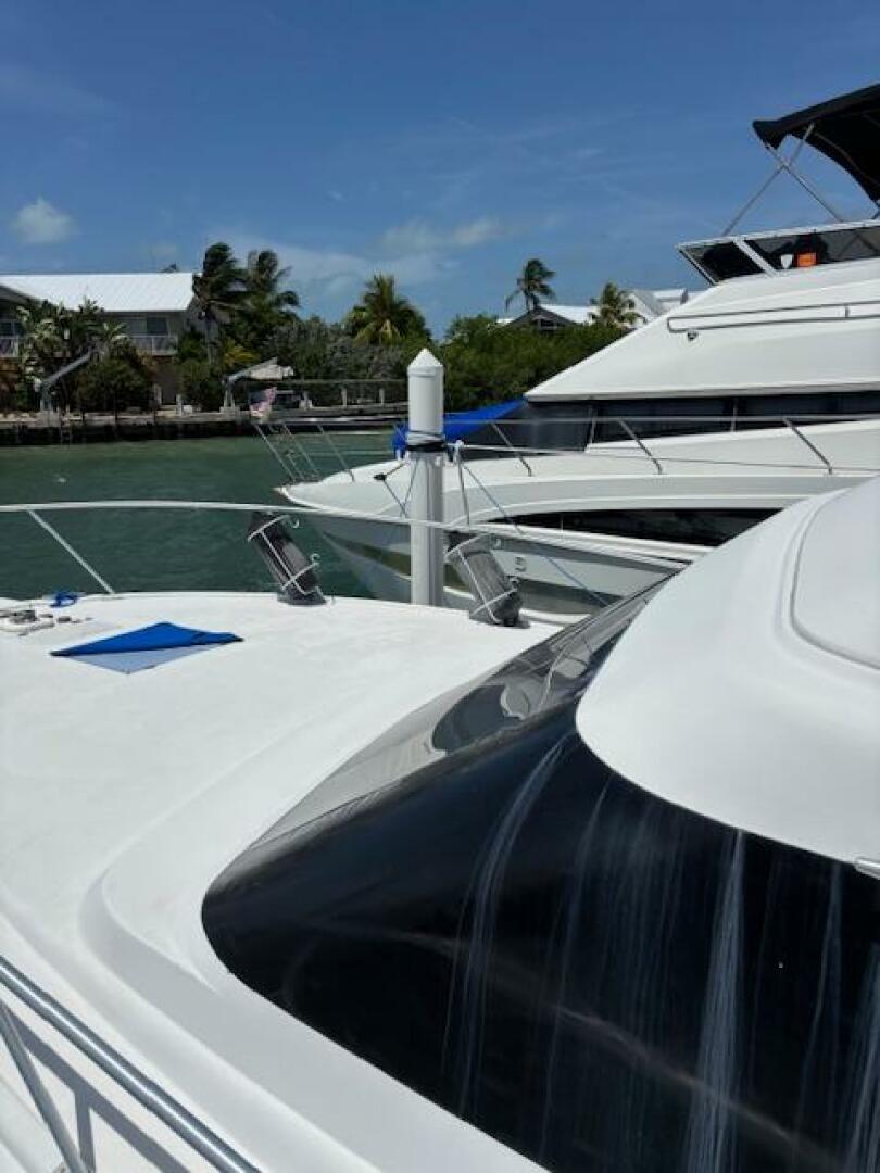 2006 Carver 43 Motor Yacht docked in sunny marina with palm 