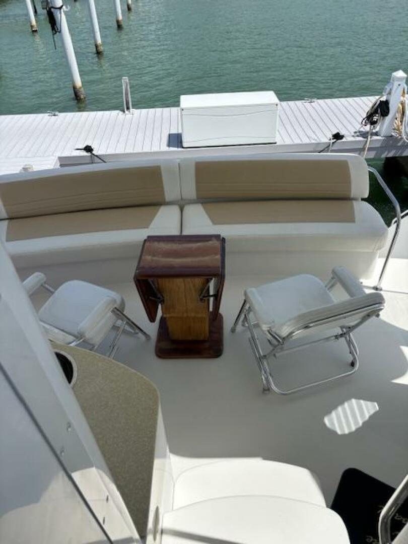 2006 Carver 43 Motor Yacht deck with seating and table, dock