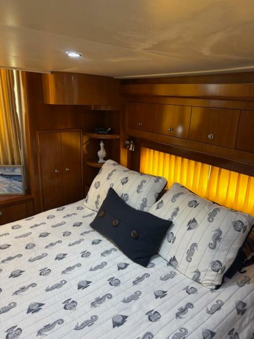 Luxurious bedroom interior of 2006 Carver 43 Motor Yacht wit