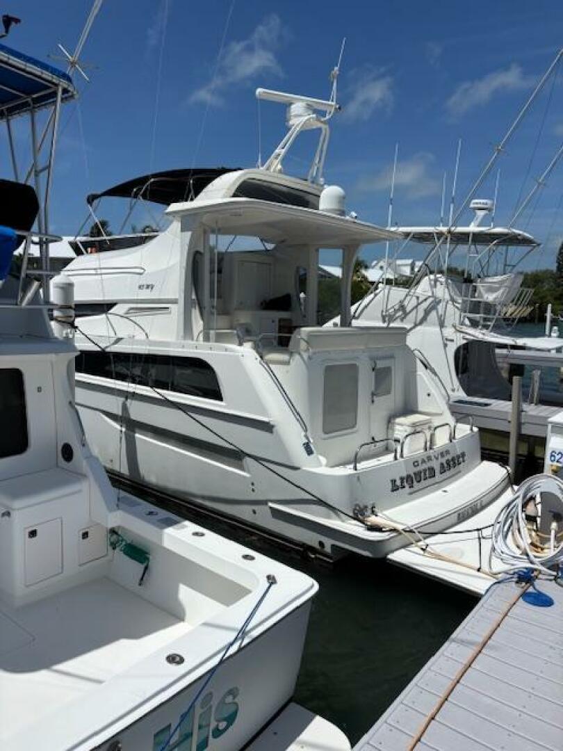 2006 Carver 43 Motor Yacht docked at marina under clear blue