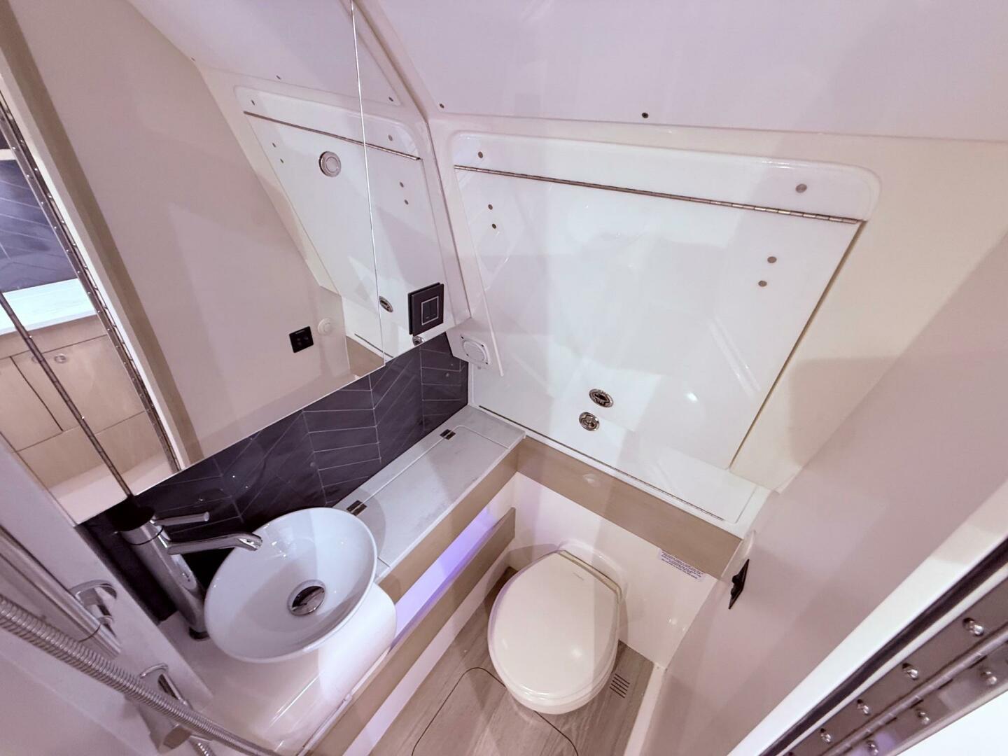 Luxurious bathroom interior of 2024 Scout 400 LXF boat, feat