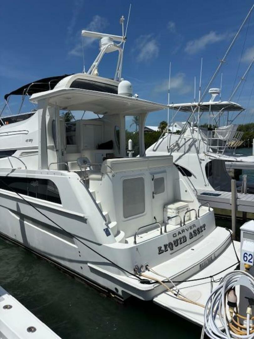 2006 Carver 43 Motor Yacht docked at marina under clear blue