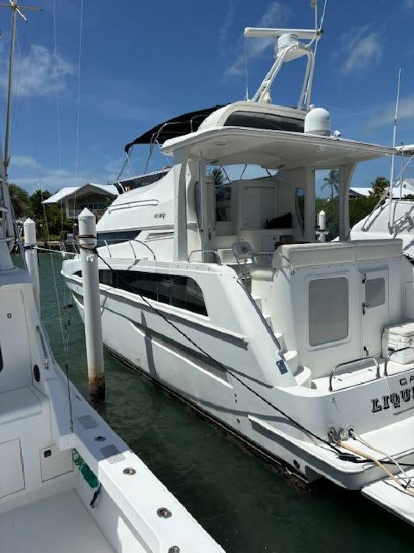 2006 Carver 43 Motor Yacht docked at marina under clear blue
