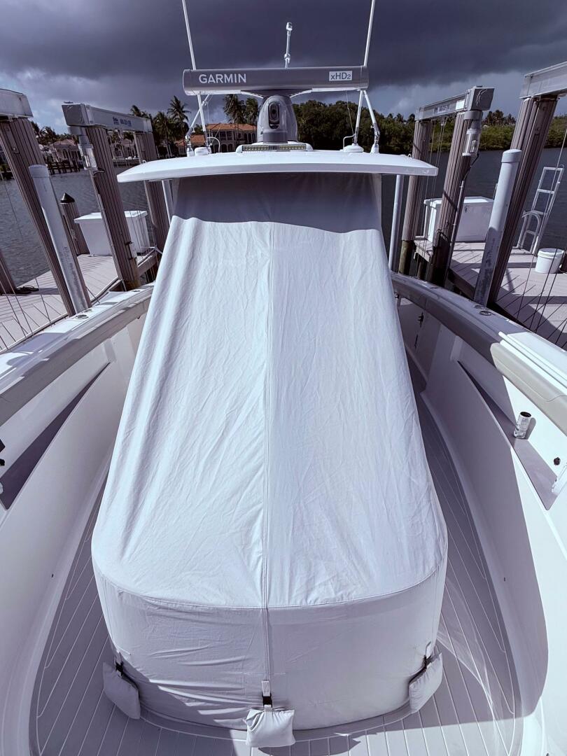 2024 Scout 400 LXF boat with covered console, docked under c