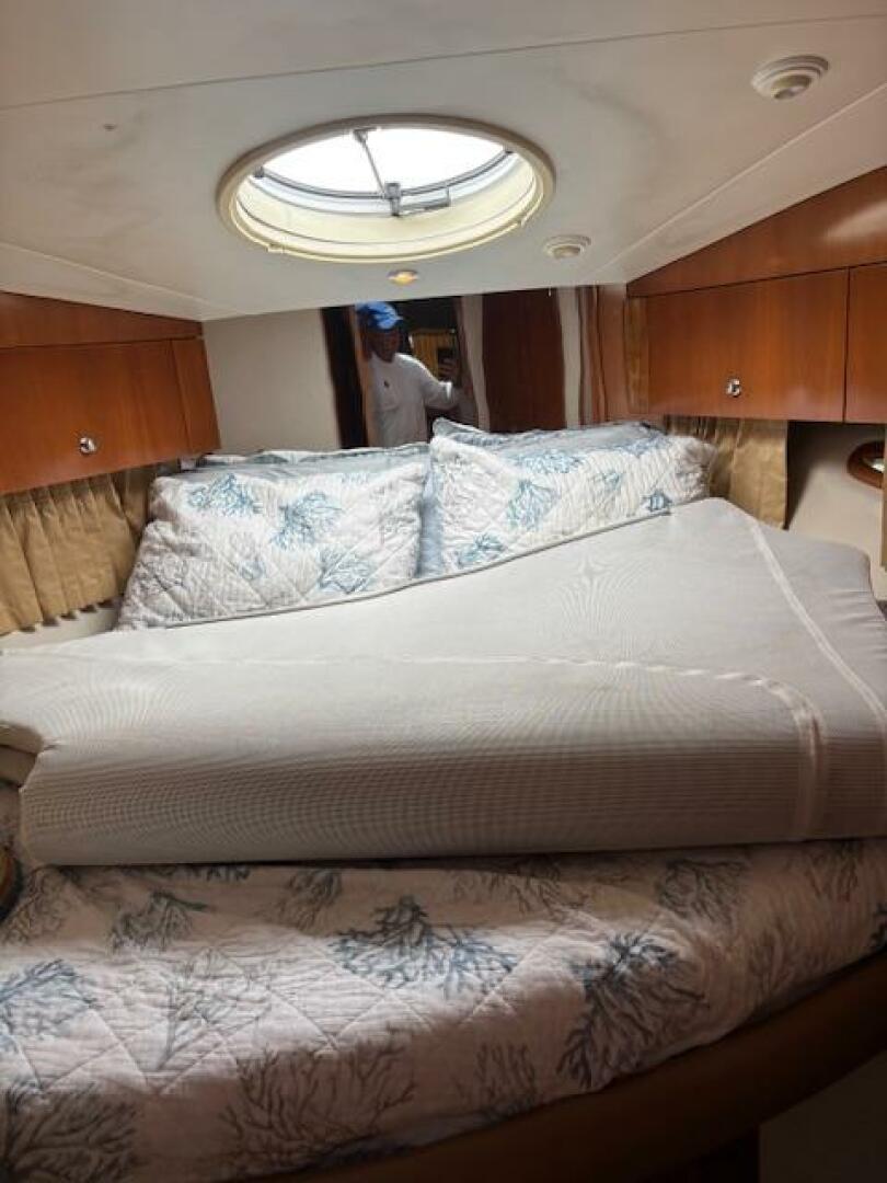 Interior of 2006 Carver 43 Motor Yacht with cozy bed and por