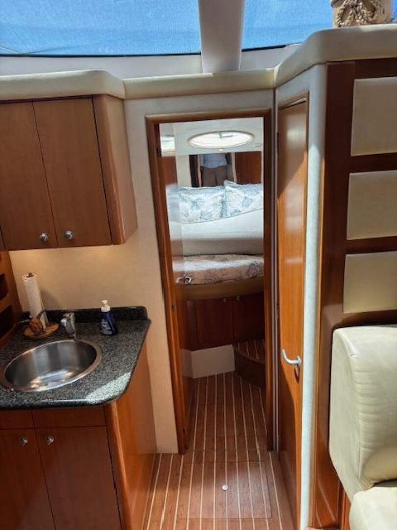 2006 Carver 43 Motor Yacht interior with wood cabinetry, sin