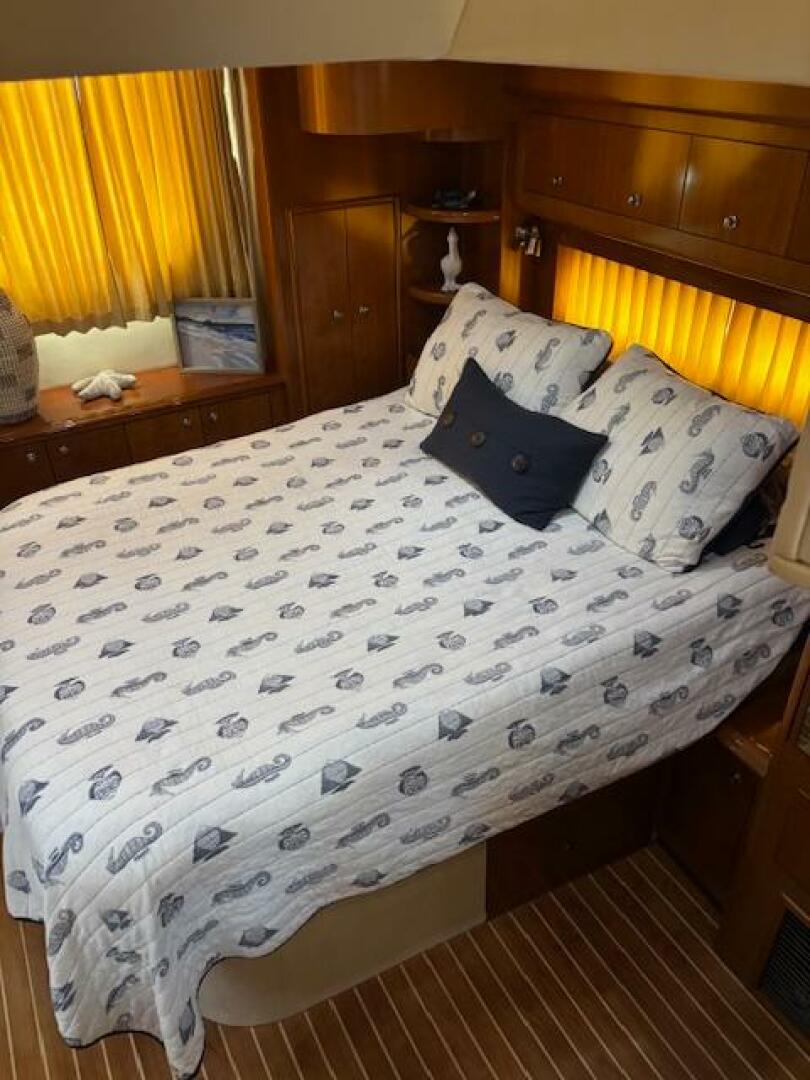 Cozy bedroom in 2006 Carver 43 Motor Yacht with nautical-the