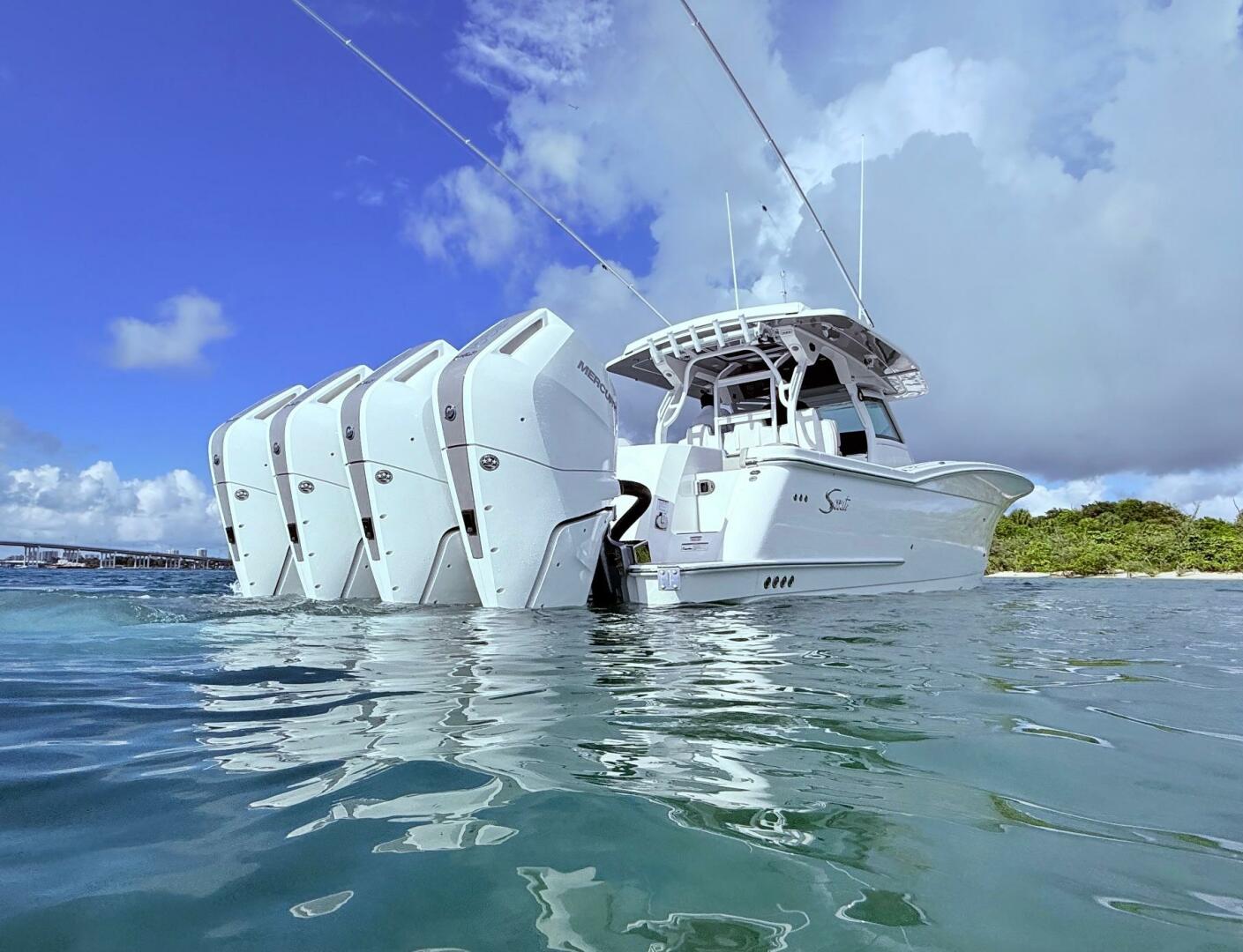 2024 Scout 400 LXF boat with multiple outboard engines on ca