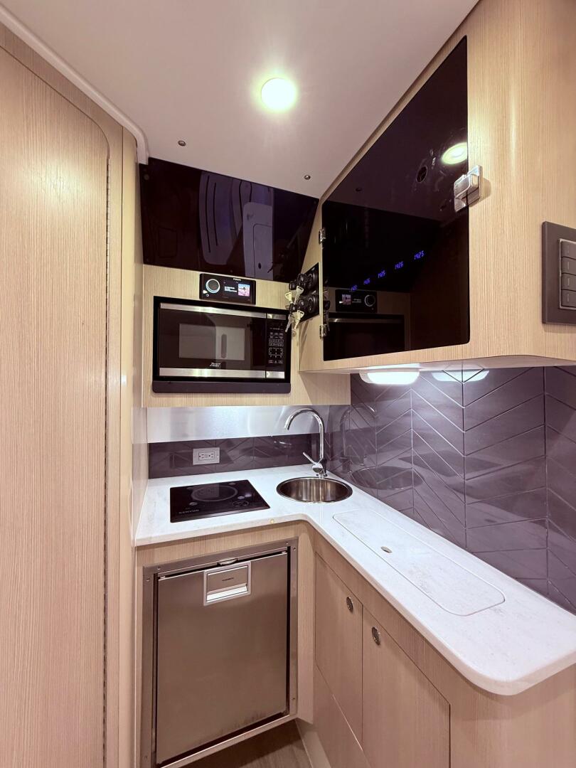2024 Scout 400 LXF yacht kitchen with modern appliances and 