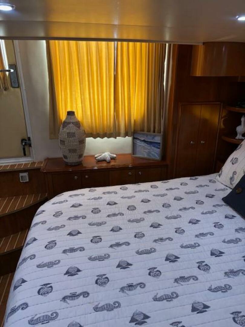 Cozy bedroom interior of 2006 Carver 43 Motor Yacht with nau