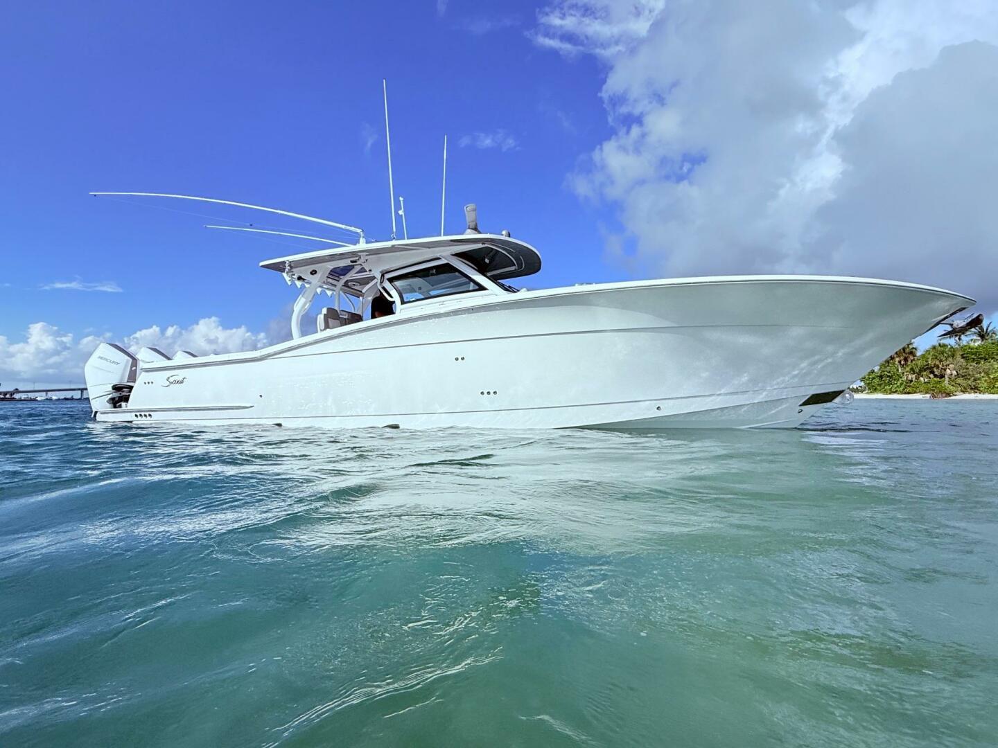2024 Scout 400 LXF boat on clear blue water under a bright s