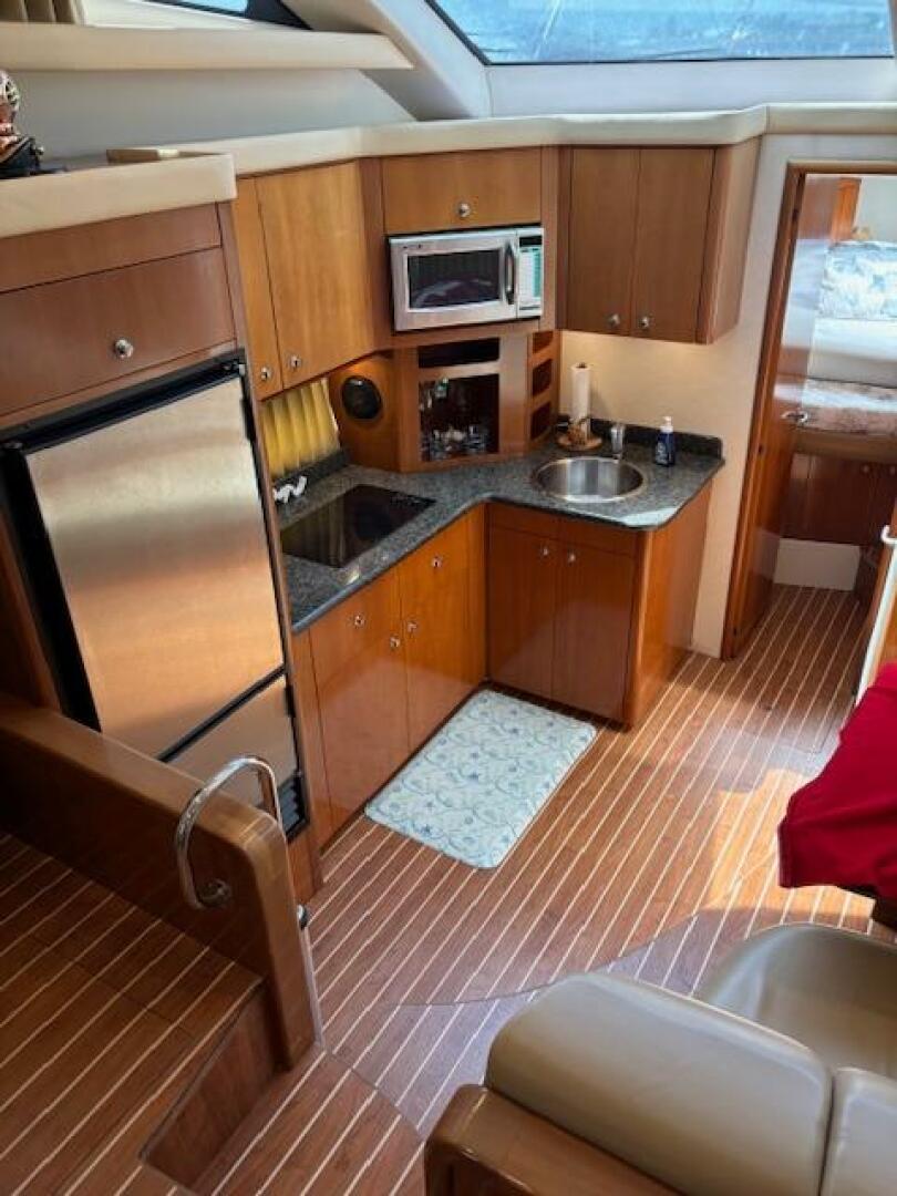Interior of 2006 Carver 43 Motor Yacht with kitchen and wood