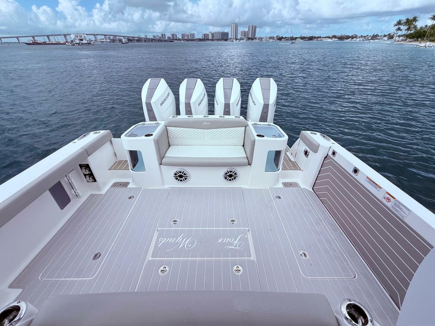2024 Scout 400 LXF boat deck with four engines, overlooking 