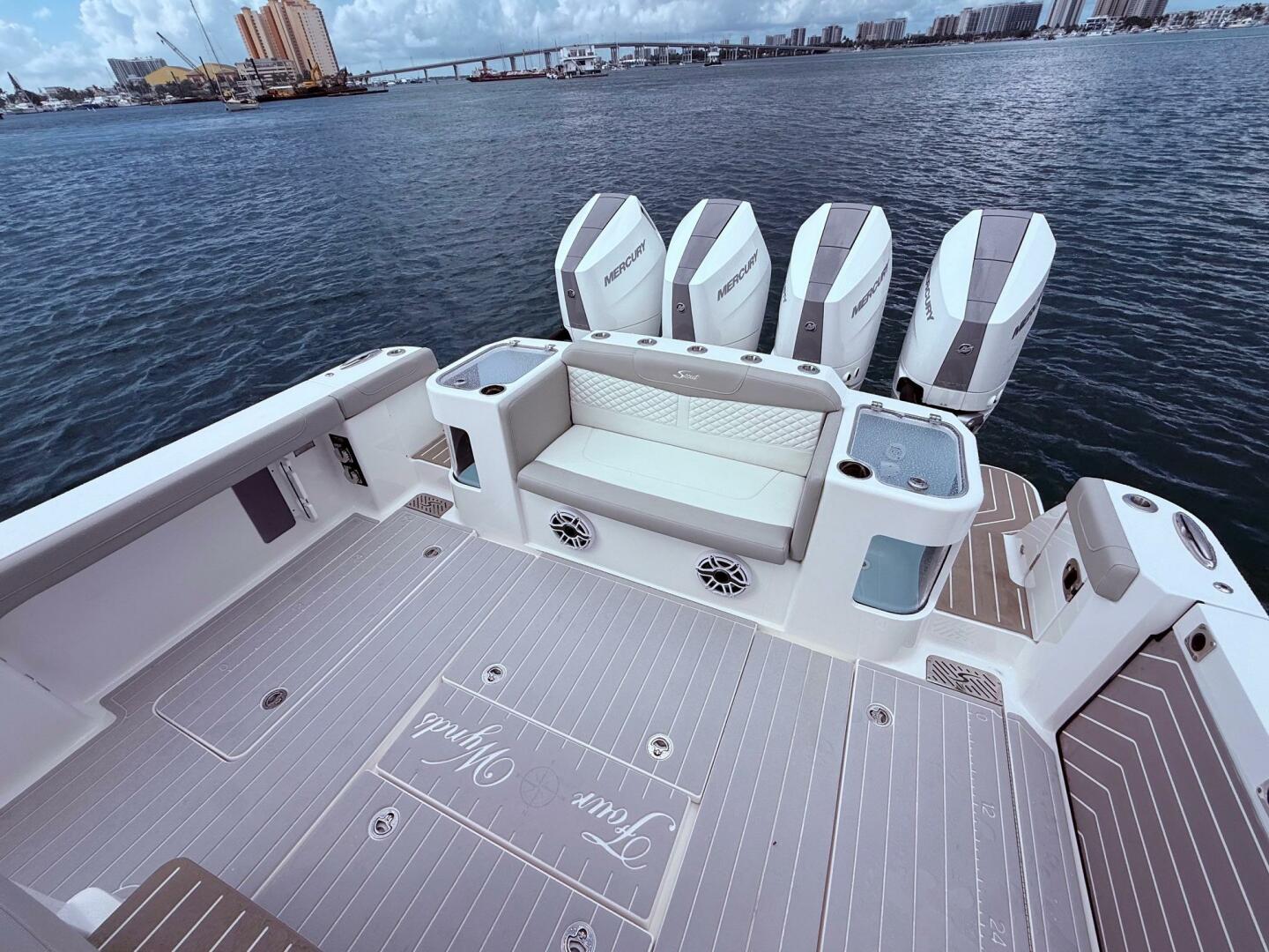 2024 Scout 400 LXF boat deck with seating and multiple Mercu