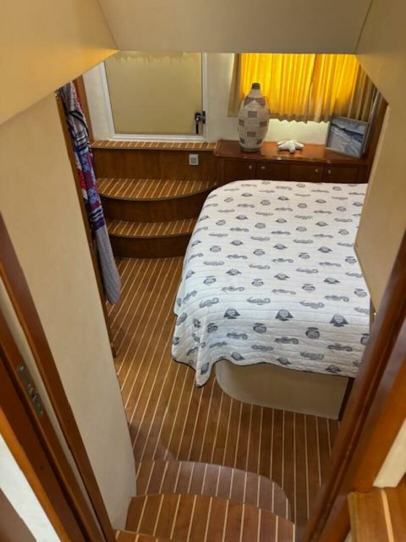 Interior of 2006 Carver 43 Motor Yacht with cozy bedroom and