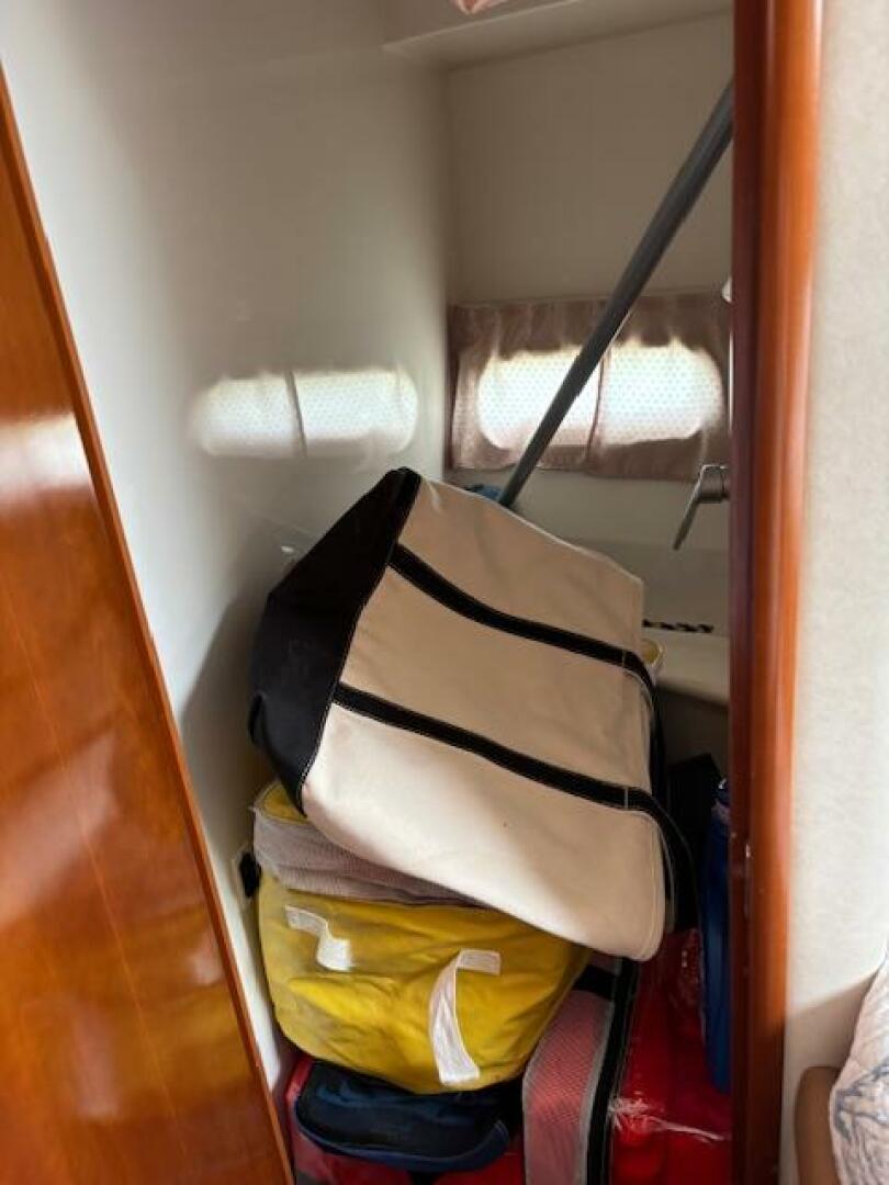 Storage area inside 2006 Carver 43 Motor Yacht with bags and