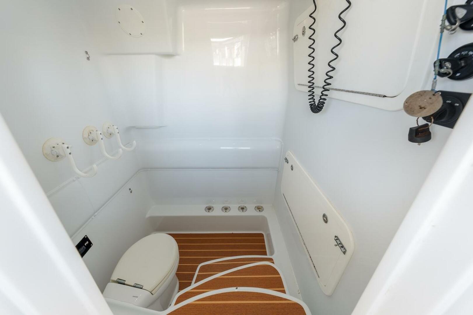 2015 Yellowfin 39 boat interior with toilet and wooden floor