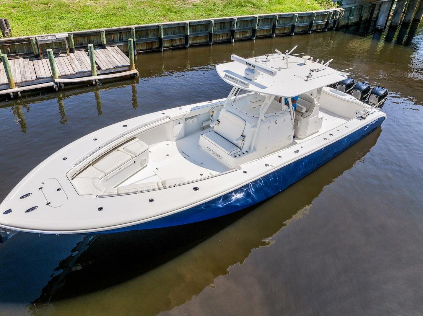 2015 Yellowfin 39 boat docked on calm water, featuring sleek