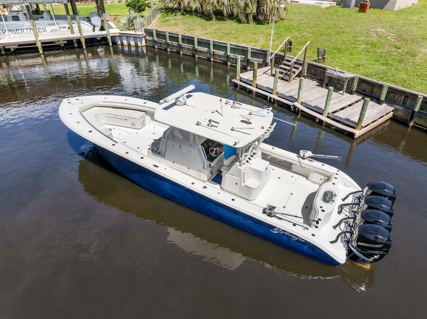 2015 Yellowfin 39 boat with quad Mercury engines docked in a