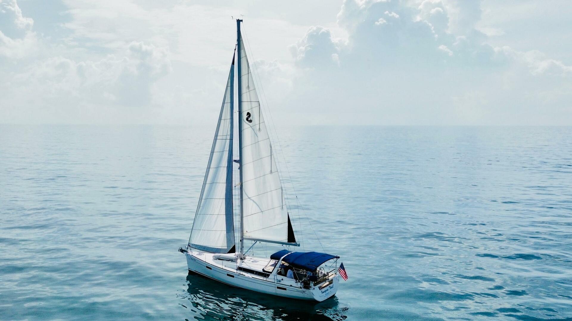 Sailing yacht Beneteau Oceanis 45, 2015 model, on calm ocean