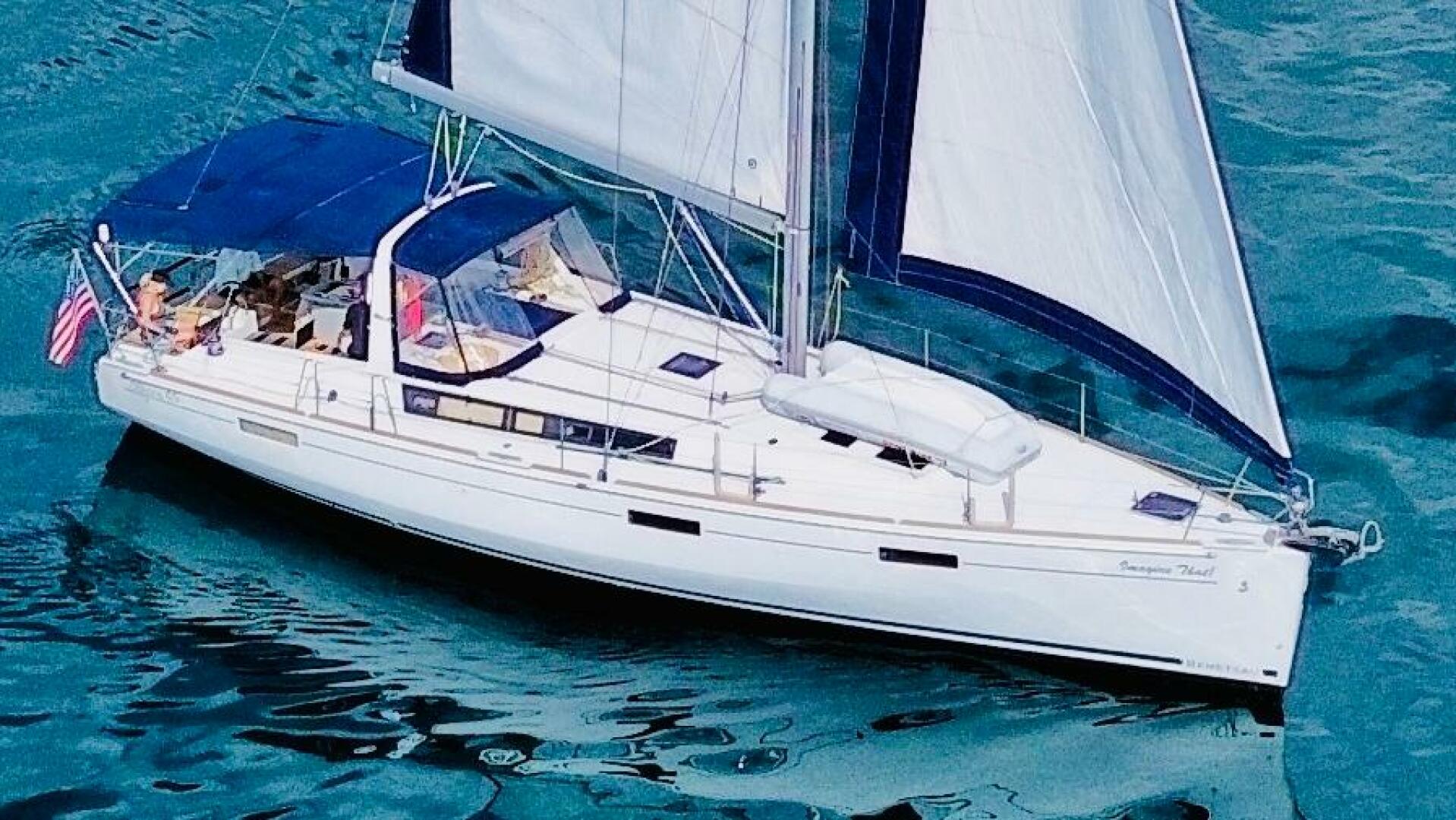 2015 Beneteau Oceanis 45 sailboat cruising on clear blue wat
