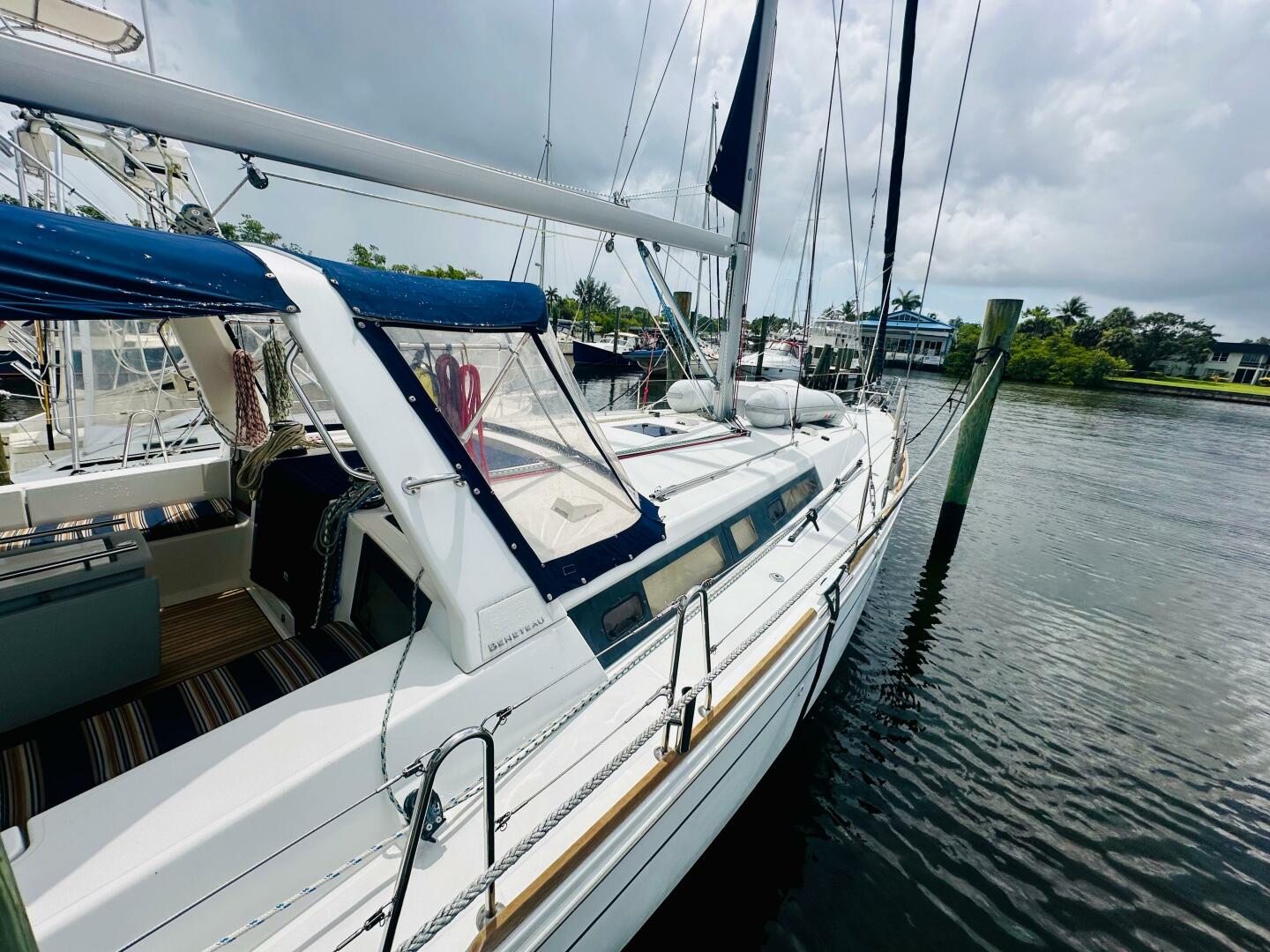 2015 Beneteau Oceanis 45 sailboat docked on a calm waterway 