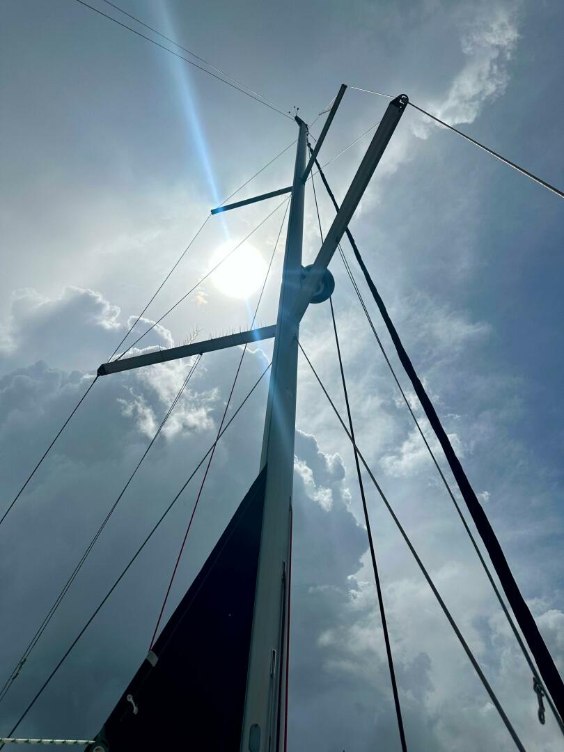 Mast of 2015 Beneteau Oceanis 45 sailboat against cloudy sky