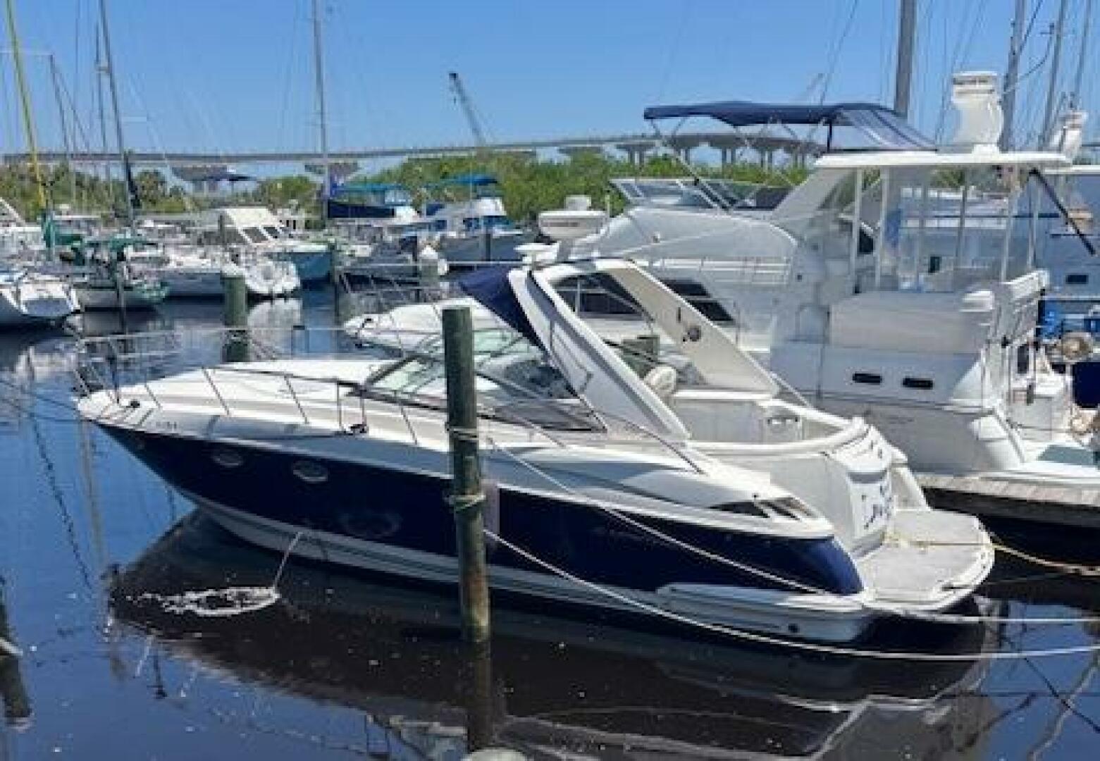 2007 Monterey 350 Sport Yacht docked in a marina with other 