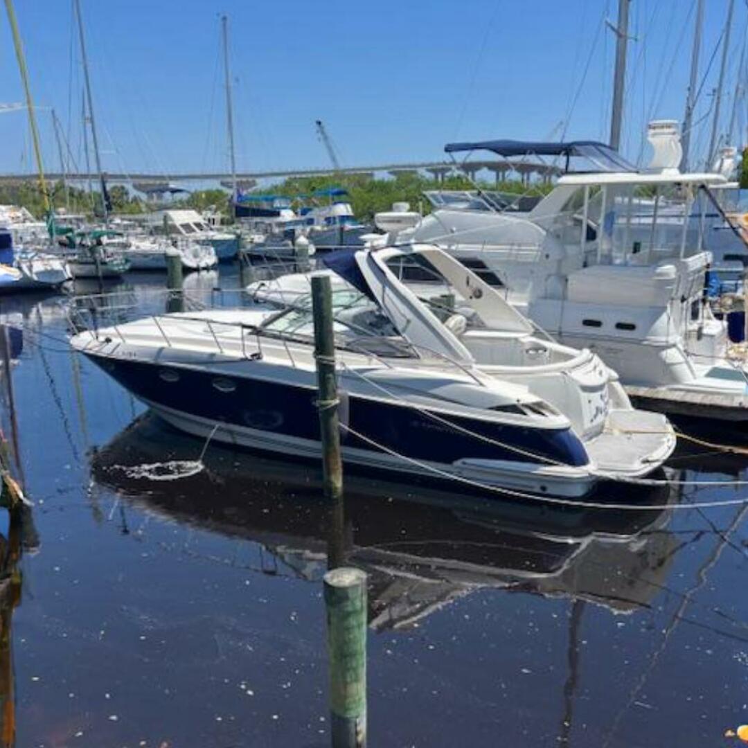 2007 Monterey 350 Sport Yacht docked at a marina, surrounded