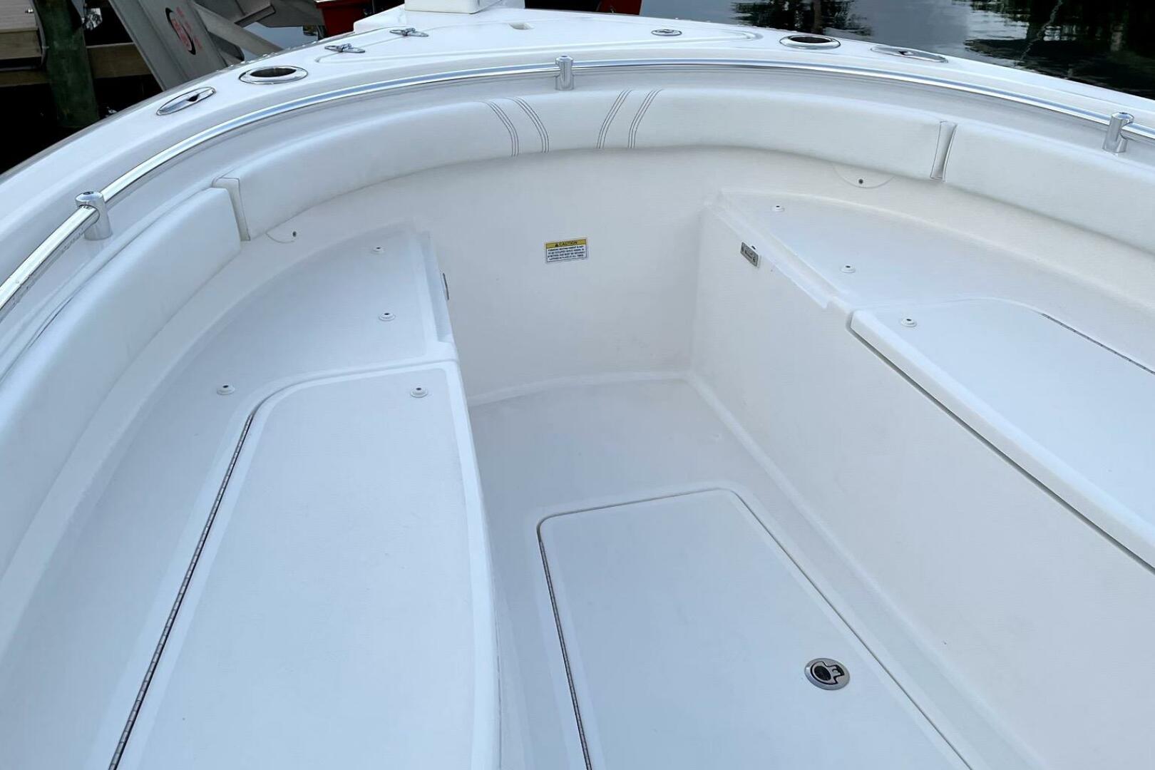 2023 Contender 24 Sport boat interior with white seating and