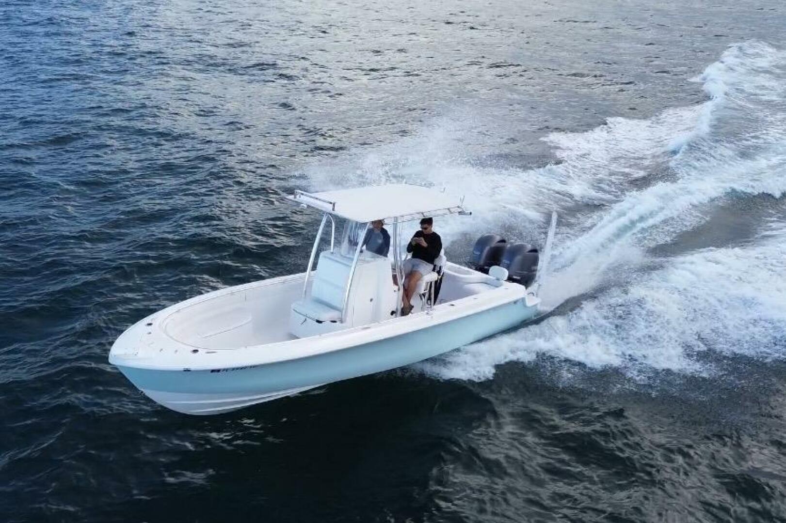 2023 Contender 24 Sport boat cruising on open water, showcas